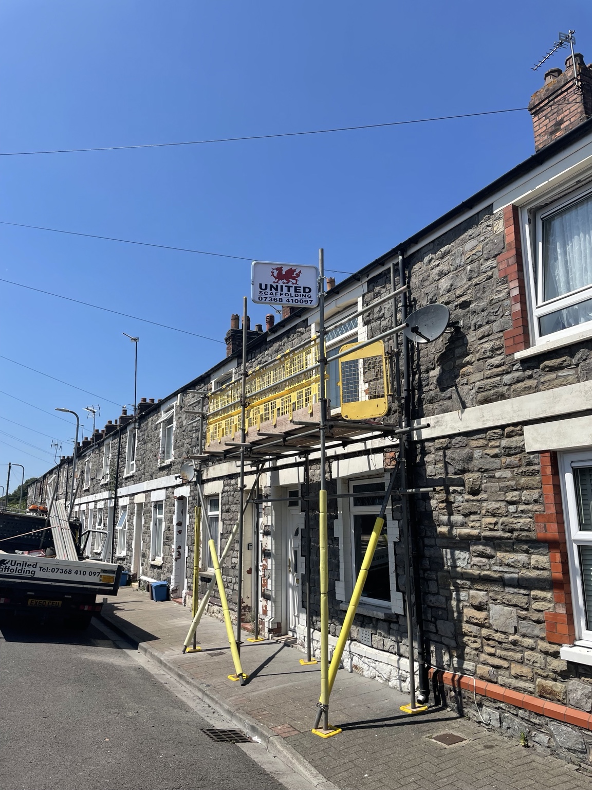 United Scaffolding project with company sign