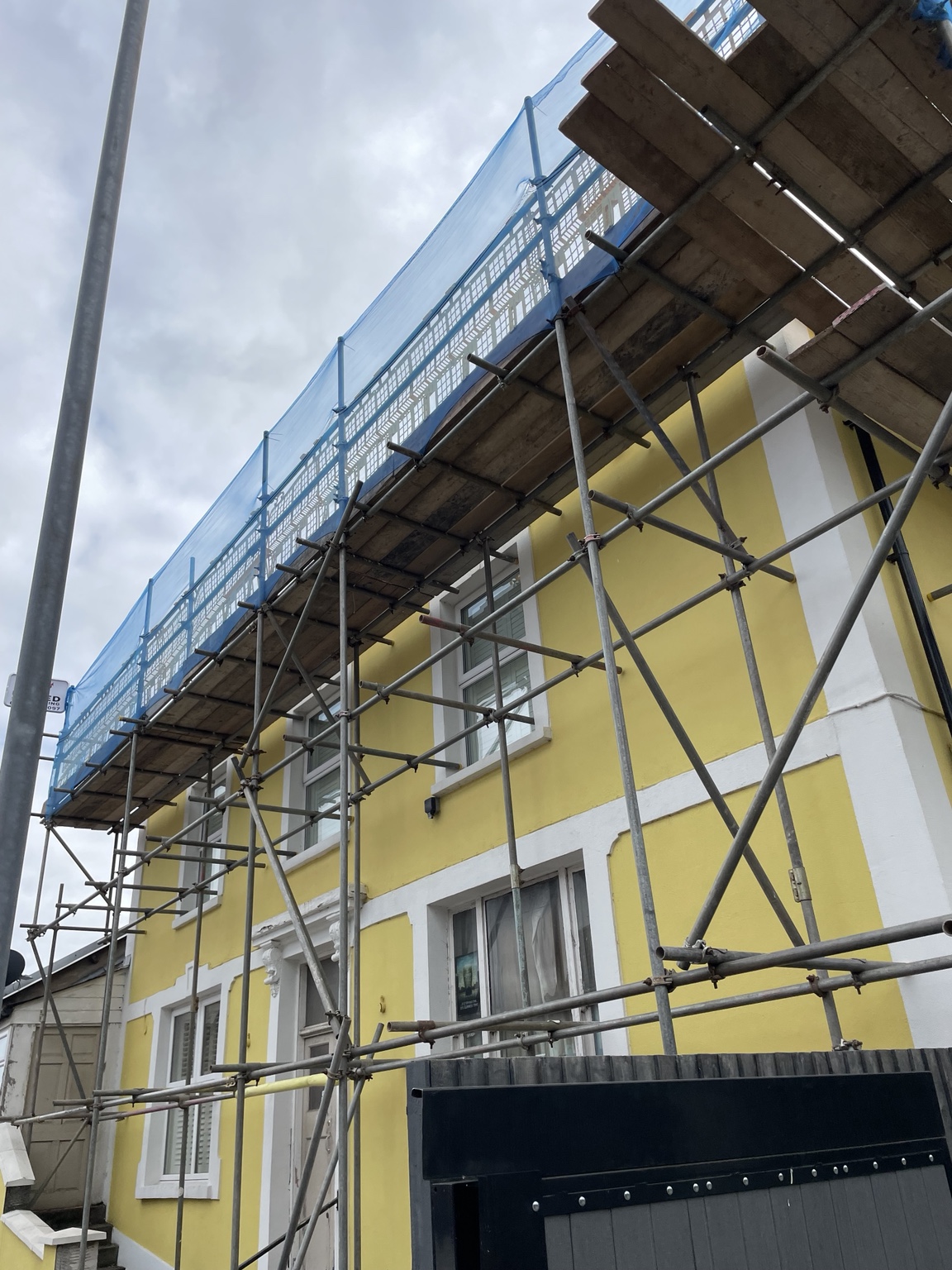 Scaffolding on a yellow-fronted property